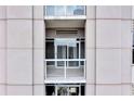 A close-up of a balcony featuring sliding glass doors with white trim at 2881 Peachtree Ne Rd # 1202, Atlanta, GA 30305