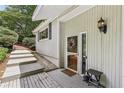 This covered side entrance features a classic design and is inviting for visitors at 405 Forest Valley Road, Sandy Springs, GA 30342