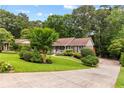 Charming single-story home with a well-manicured front yard and inviting curb appeal at 621 Windgrove Se Rd, Marietta, GA 30067