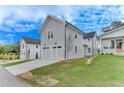 This home features a two-car garage, and manicured front yard at 1294 Six Sisters St, Dacula, GA 30019