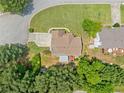 Birds-eye view of a house on a large lot with a spacious backyard and patio area at 1975 Fairway Close Ter, Lawrenceville, GA 30043