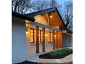 Inviting exterior view of home illuminated at dusk, highlighting the architectural details and warm lighting at 442 Mountain Park Trl, Stone Mountain, GA 30087
