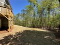 Expansive backyard with trees creates a nature setting for outdoor activities at 66 Pine Creek Ct, Dallas, GA 30157