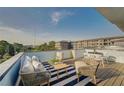 Relaxing rooftop patio featuring stylish furniture and a striped rug at 816 Berne St # 6, Atlanta, GA 30316