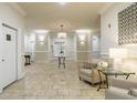 Elegant lobby with travertine floors, stylish furnishings, designer lighting, and neutral color palette, exuding sophistication and comfort at 11 Perimeter E Ctr # 1412, Atlanta, GA 30346