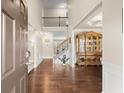 Grand foyer with hardwood floors, high ceilings, and staircase leading to the second floor at 1709 Grove Se Ct, Conyers, GA 30013