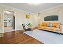 Comfortable living room featuring hardwood floors adjacent to the well-appointed kitchen at 869 Briarcliff Ne Rd # B20, Atlanta, GA 30306