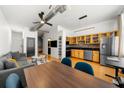 Open concept living room and kitchen featuring hardwood floors, modern lighting, and dining area at 800 Peachtree Ne St # 8607, Atlanta, GA 30308