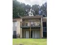 Balcony with wood railings and outdoor furniture, perfect for enjoying the surrounding view at 3575 Oakvale Rd # 919, Atlanta, GA 30034