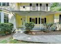 Inviting front porch with classic columns and a well-maintained walkway leading to the entrance at 10035 Anaheim Dr, Alpharetta, GA 30022