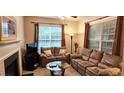 Comfortable living room with a fireplace and lots of natural light at 3150 Woodwalk Se Dr # 3112, Atlanta, GA 30339