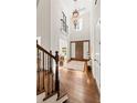 Grand foyer with high ceilings, hardwood floors, and a chandelier at 5140 Long Island Nw Dr, Sandy Springs, GA 30327