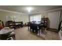Spacious living area featuring lots of natural light and tile floors at 932 Chippendale Ln, Norcross, GA 30093