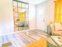 Stylish living room with large mirror accent, wood floors, and natural light at 2190 Gordon Se Cir, Smyrna, GA 30080