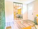 Bright living room featuring modern wall mirror, plank floors, and inviting decor at 2190 Gordon Se Cir, Smyrna, GA 30080