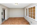 Empty living room featuring weathered floors and natural light at 2767 Kathie Ln, Ellenwood, GA 30294