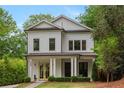 Attractive two-story home showcasing a meticulously maintained lawn, delightful curb appeal, and an inviting front porch at 357 Mell Ave # A, Atlanta, GA 30307