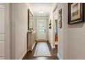 Bright entryway with hardwood floors, light gray walls, and elegant furnishings at 2965 Westlington Cir, Cumming, GA 30040