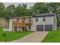 Charming two-story home featuring a spacious front yard, upper balcony, and a two car garage at 3233 Glynn Mill Dr, Snellville, GA 30039