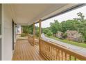 Spacious porch with wood railings and serene neighborhood views perfect for relaxation and enjoyment at 3233 Glynn Mill Dr, Snellville, GA 30039