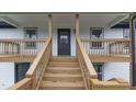 Inviting covered porch features sturdy railings and provides access to the home's entrance at 3233 Glynn Mill Dr, Snellville, GA 30039