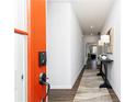 Bright entry hallway with elegant decor and wood-look flooring leads into the inviting living space at 440 Madison Lakeview Dr, Acworth, GA 30102