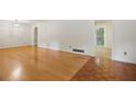 Bright living room featuring hardwood floors and an open layout, perfect for entertaining at 1960 Oak Leaf Sw Ct, Marietta, GA 30008