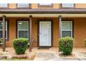 Inviting front porch with manicured bushes and a clear view of the home's entrance at 4424 English Loop, Stonecrest, GA 30038