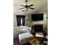 Inviting living room with a fireplace, flat screen, and comfortable seating at 45 Avery Drive, Covington, GA 30016