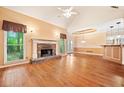 Spacious living room with hardwood floors and a stunning stone fireplace at 120 Bent Creek Dr, Woodstock, GA 30189