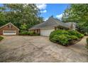Long driveway leading to a spacious three car garage adjacent to the well maintained home at 362 Clyde Ct, Mcdonough, GA 30252