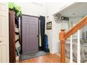 Warm entryway featuring a light color scheme, wood accents, and ample natural light at 1382 Koble Mill Ln, Riverdale, GA 30296