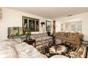 Cozy living room with comfortable seating and carpeted floors at 1382 Koble Mill Ln, Riverdale, GA 30296