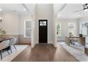 Bright open foyer with hardwood floors, white walls and trim, and view to living spaces at 912 Sunny Meadows Ln, Marietta, GA 30062