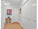 Hallway with large closets and a white door at 620 Peachtree Ne St # 1111, Atlanta, GA 30308