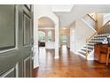 Inviting foyer with hardwood floors, high ceilings, open to the dining room and staircase at 1489 Belmont Hills Dr, Suwanee, GA 30024