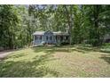 Charming home with lush greenery, and beautiful front lawn at 3030 Winchester Dr, Cumming, GA 30041