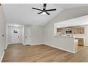 Spacious living room boasting hardwood floors, ample natural light, and an open layout to the kitchen at 8592 Hidden Creek Cir, Snellville, GA 30039