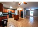 Spacious kitchen with stainless steel appliances and view of living area at 122 Summer Pl, Norcross, GA 30071
