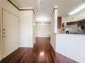 Open-concept living area with hardwood floors, granite countertops, and stainless steel appliances at 200 Renaissance Ne Pkwy # 310, Atlanta, GA 30308