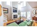 Bright living room with a cozy fireplace, large windows, and hardwood floors creating an inviting space at 2092 Wood Nw Trl, Atlanta, GA 30318