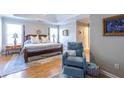 Spacious main bedroom with tray ceilings, large windows and a cozy sitting area with natural light at 2092 Wood Nw Trl, Atlanta, GA 30318