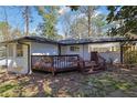 Private backyard with wood deck and stone patio, great for outdoor entertaining at 696 Kenilworth Cir, Stone Mountain, GA 30083