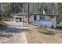 Charming renovated home with white painted brick and a covered carport, great curb appeal at 696 Kenilworth Cir, Stone Mountain, GA 30083