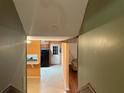 Hallway with view of kitchen and doorway to the adjacent living room at 1681 Sw Hammond Woods Sw Cir, Marietta, GA 30008