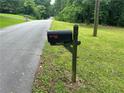 Mailbox with address number 1681 on a sunny and wooded lot at 1681 Sw Hammond Woods Sw Cir, Marietta, GA 30008