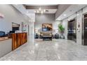 Elegant building lobby featuring tile floors, a reception desk, seating area, and elevator access at 1100 Howell Mill Nw Rd # 212, Atlanta, GA 30318