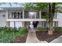 Exterior view of the building with well-maintained landscaping at 1150 Collier Nw Rd # 6H, Atlanta, GA 30318