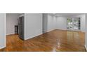 Spacious living area featuring hardwood floors and access to outdoor space at 1150 Collier Nw Rd # 6H, Atlanta, GA 30318