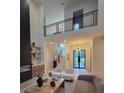 Bright open concept living room with fireplace and a view of the staircase at 1820 Lake Dow Rd, Mcdonough, GA 30252